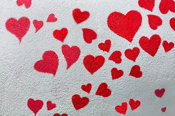 Red heart on the wall for background.