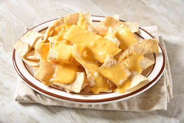 Tortilla chips with cheese sauce