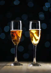 Two Glasses of Champagne Dark Glow Lights Background