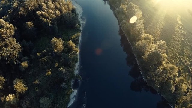 Cinemtaic Wilderness Aerial Over River with Lens Flare