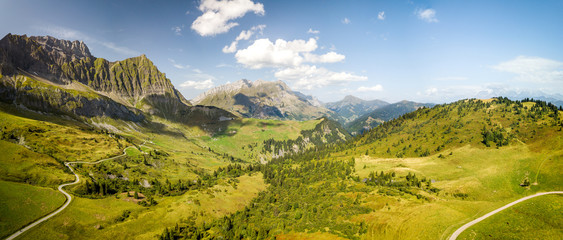 Panoramic aerial view of the moutains in the Col des Aravis in the French alps on a sunny day