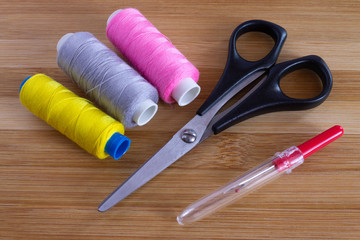 Sewing accessories on wooden table