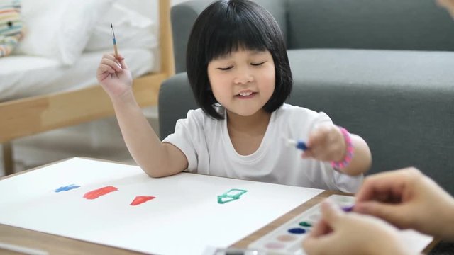 4K : Happy Asian Mother and daughter together paint, Happiness moment at home