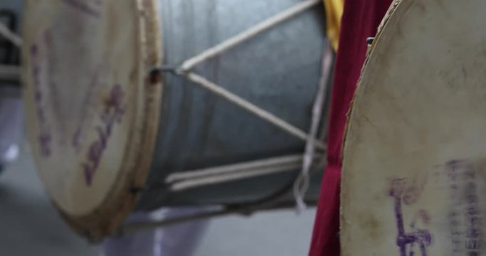 Young men playing India drum, Dhol, during Ganesh Festival in Pune, Maharashtra, India.