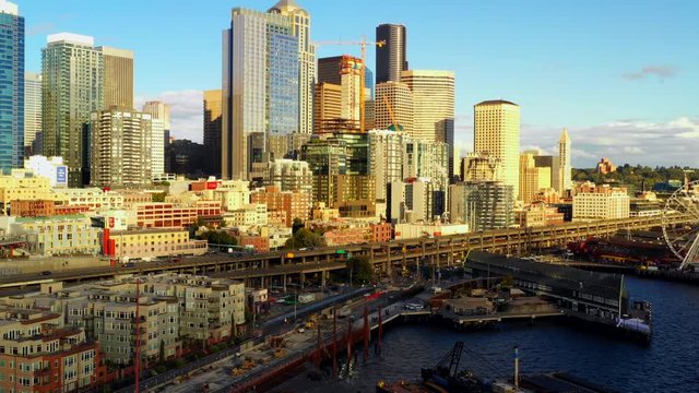 Aerial stock footage Seattle Downtown and harbor piers