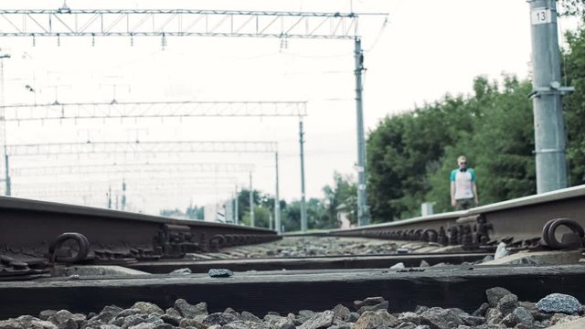 man crosses the railroad in the wrong place, life threatening