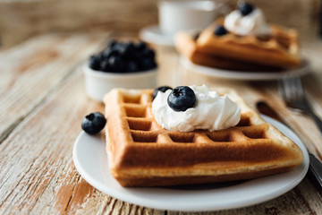 Brussels waffles with blueberry and whipped cream