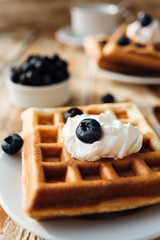 Brussels waffles with blueberry and whipped cream