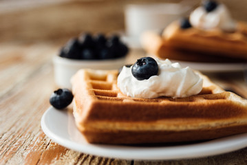 Brussels waffles with blueberry and whipped cream