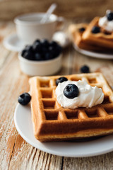 Brussels waffles with blueberry and whipped cream
