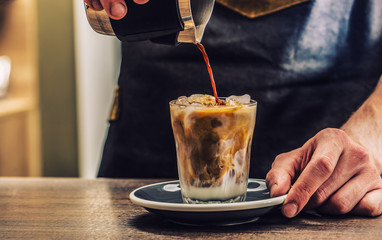 Close-up a barista making fres ice coffee on barcounter