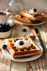 Brussels waffles with blueberry and whipped cream