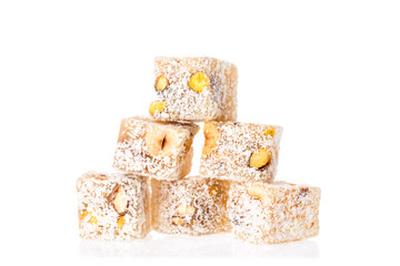 Turkish delight lokum with pistachio nuts isolated on a white background