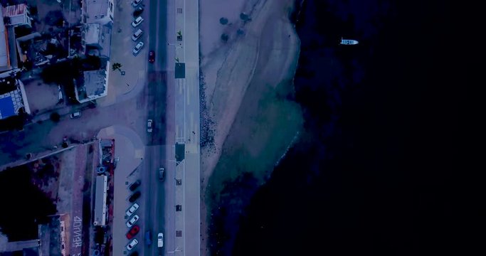 La Paz Mexico Drone Aerial 4K OVERHEAD on El Malecon then Tilt Up down length of Road at Twilight