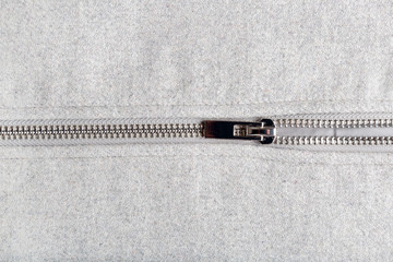 silver zip on woolen fabric