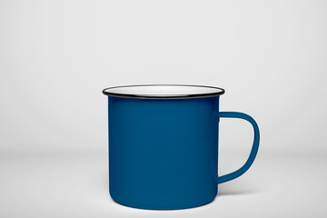 Blue blank enamel mug isolated on white background