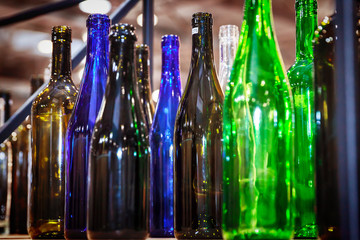 empty glass bottles of different colors, close up