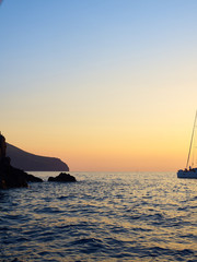 View at sunset of the little island near Stromboli volcano, with its characteristic horse head like...