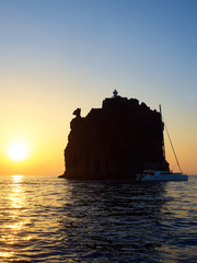 View at sunset of the little island near Stromboli volcano, with its characteristic horse head like...