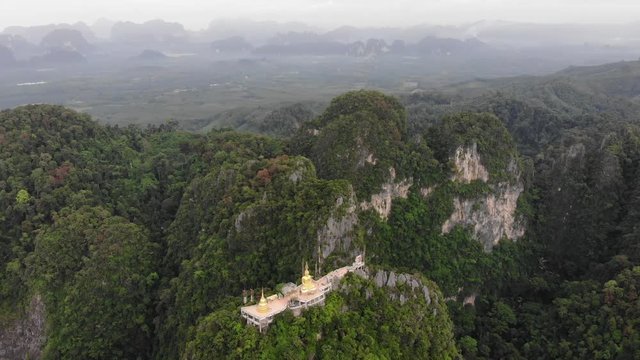 Aerial view of hight green mountains in thailand at sunrise
