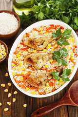 Chicken legs baked with rice and vegetables