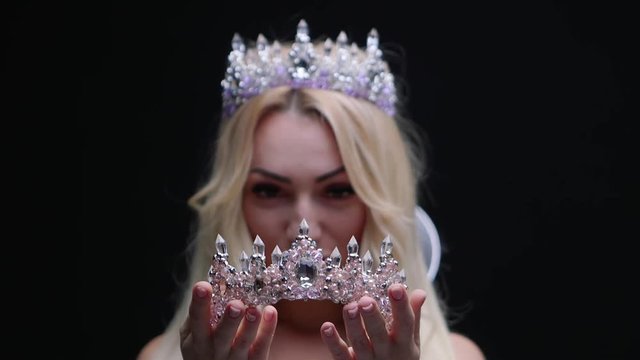 Female model in the crown posing in the studio jewelry