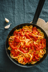 Tomato sauce spaghetti pasta on pan