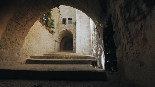 Wide shot dolly right, Nablus old city alley in west bank Palestine, Old traditional Arabic alley. Urban Sprawl. 4K