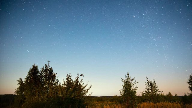 Night rural landscape with stars, time-lapse