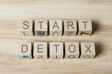 START DETOX text on wooden cubes on wooden background