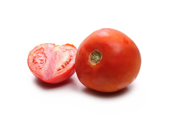 Fresh red tomato with slices isolated on white background