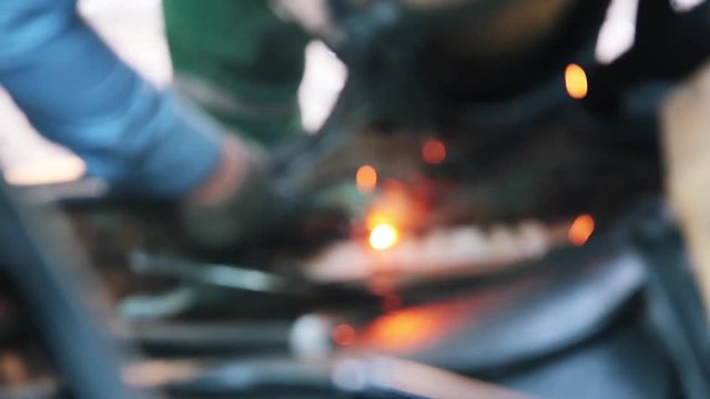 Blurred background of welding repair work.