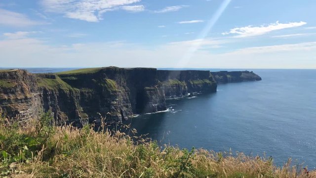 The famous Cliffs of Moher are sea cliffs located at the southwestern edge of the Burren region in County Clare, Ireland. They run for about 14 kilometres.