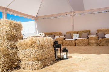 Hay decorations in wedding marquee