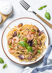 Pasta spaghetti with seafood and tomato sauce.