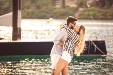 Couple in love, enjoying the summer time by the sea.