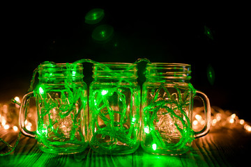 Green Fairy Light in a Glass Jars in the Dark Low-Key Photography