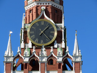 Moscow Kremlin tower clock against clear blue sky. Chimes of Spasskaya tower, symbol of Russia on...