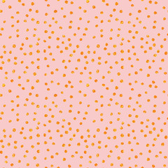 Hand Drawn seamless pattern with gold painted dots. Gift wrap, print, cloth, cute background for a card. Golden dots on pink background. Yellow gold glitter sparkling shiny.