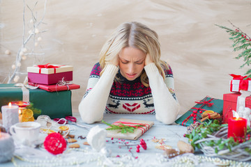 Woman in stress about Christmas holidays - obrazy, fototapety, plakaty