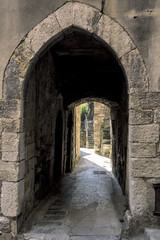 Fototapeta na wymiar Little alley in the medieval Provencal village of Roquebrune Cap Martin in French Riviera