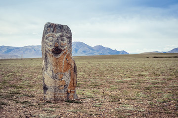 Stone statue with face. ancient altar near the village of Ortolyk. Altai, Russia