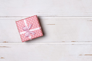 Fototapeta premium Gift box on wooden board. 