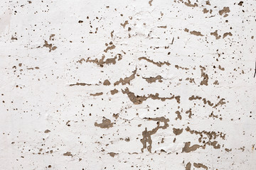 plastered brick wall with crumbling plaster