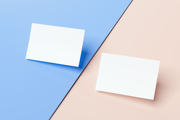 Close up of white business cards set on multicolored background, 3d rendering.
