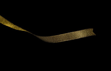 Golden ribbon isolated on black background and texture, with clipping path