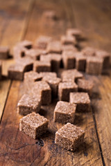 sugar cubes on rustic wood