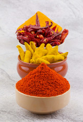 Indian Spices Collection Also Called Red Chili Powder, Turmeric Powder, Turmeric Stick, Dry Chili, Mirchi, Haldi or Dhaniya on Vintage Background