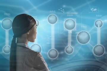Molecular Biology, Genetics and Medical Concept. An Asian woman doctor, scientist or biologist is...
