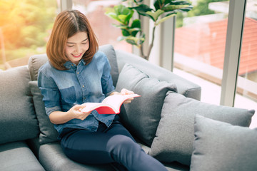 Obraz premium beautiful asian woman enjoy happiness hand reading book holiday weekend moment